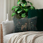 A rectangular lumbar cushion with a floral pattern featuring a bear, designed by William Morris & Co, in a forest green colour.