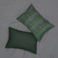 A rectangular lumbar cushion with a William Morris & Co floral pattern in shades of green and beige, featuring a concealed zipper.