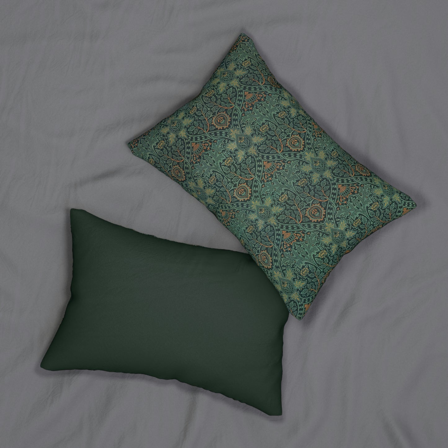 A rectangular lumbar cushion with a William Morris & Co floral pattern in shades of green and beige, featuring a concealed zipper.