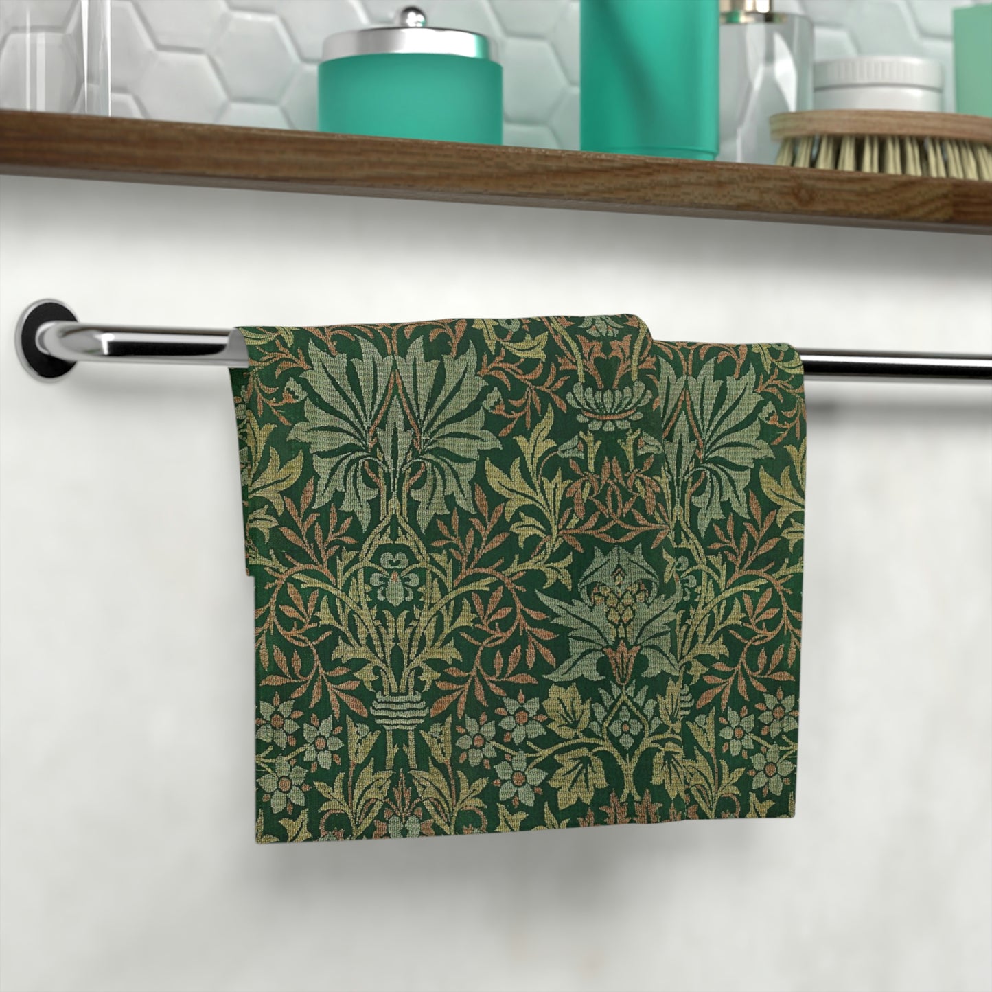 A green washcloth with a floral pattern inspired by William Morris.