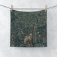 A white washcloth with a floral pattern inspired by William Morris, featuring a greenery background with a fox design.