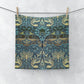 A multicoloured floral patterned washcloth inspired by William Morris' art, featuring peacock and dragon designs.