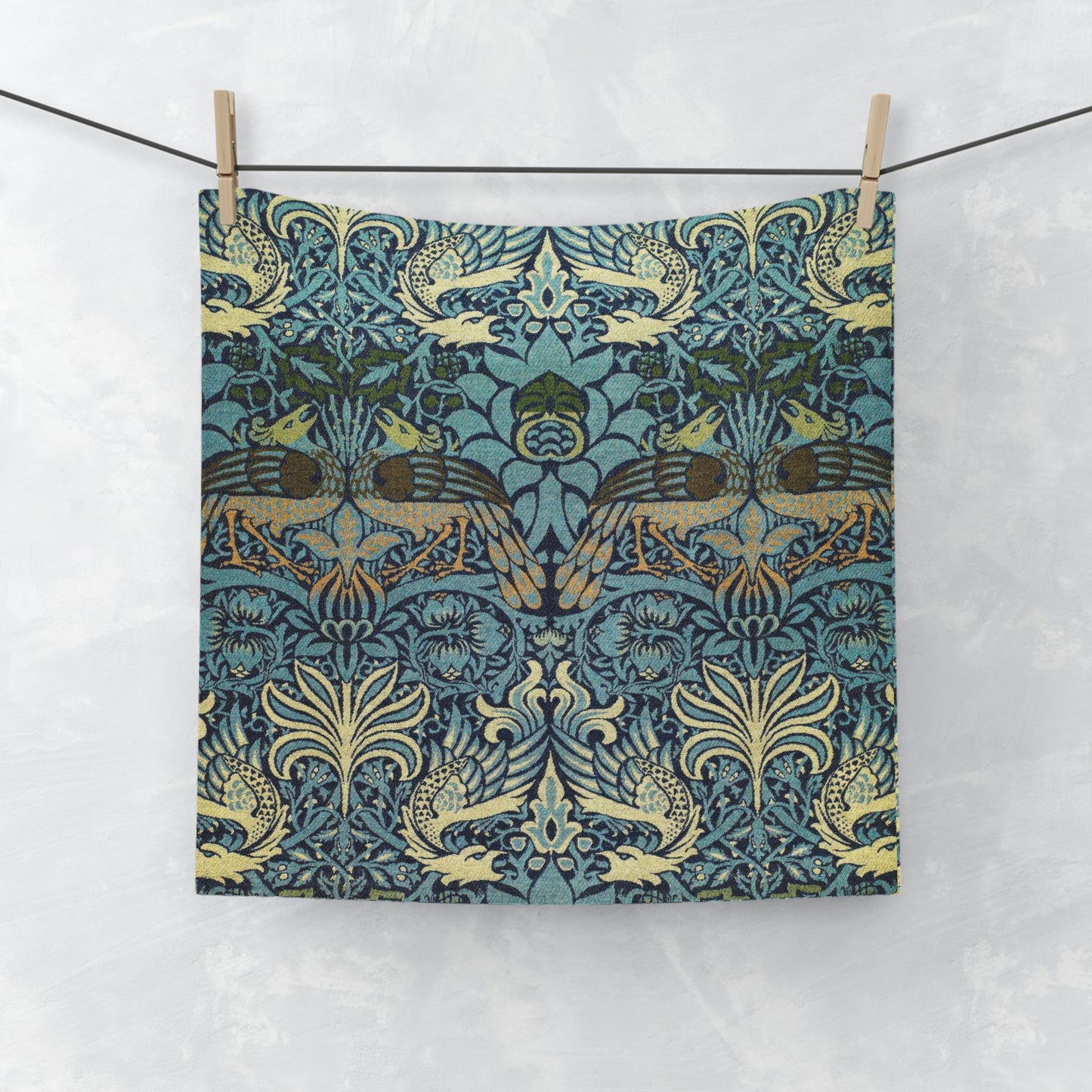 A multicoloured floral patterned washcloth inspired by William Morris' art, featuring peacock and dragon designs.
