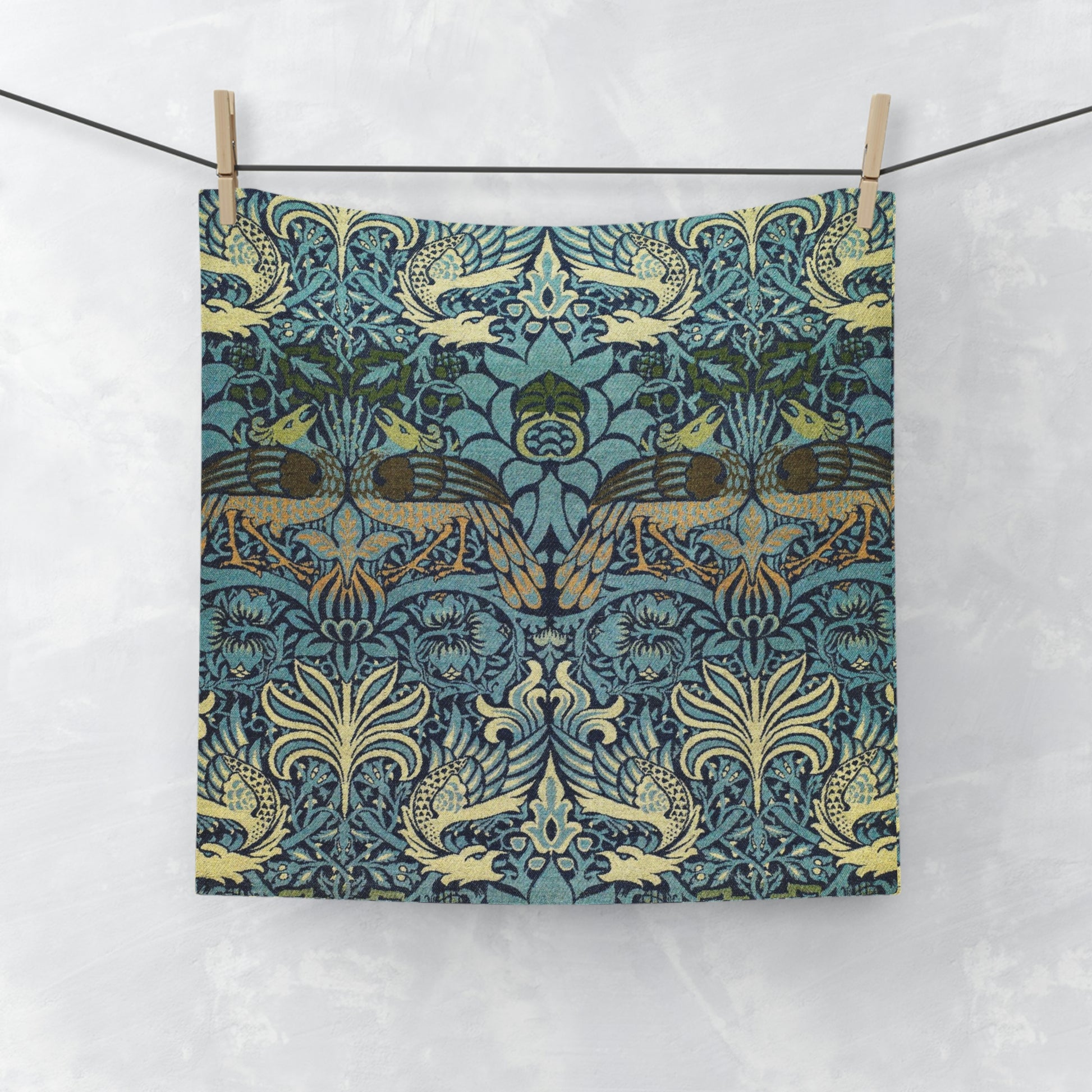 A multicoloured floral patterned washcloth inspired by William Morris' art, featuring peacock and dragon designs.