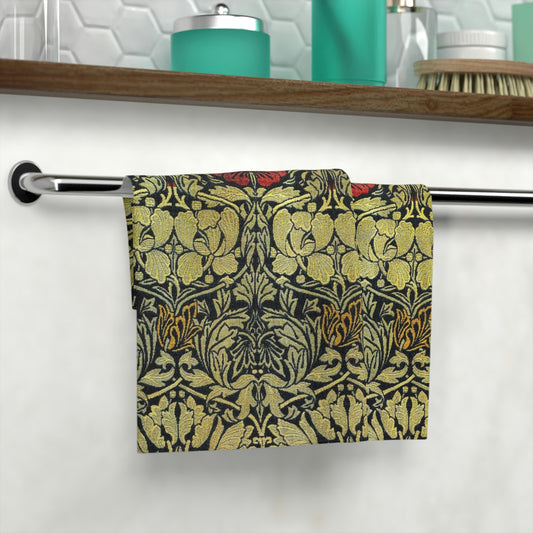 A washcloth with a floral pattern inspired by William Morris, featuring tulips and roses in red and green colors on a beige background.