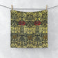 A washcloth with a floral pattern inspired by William Morris, featuring tulips and roses in red and green colors on a beige background.