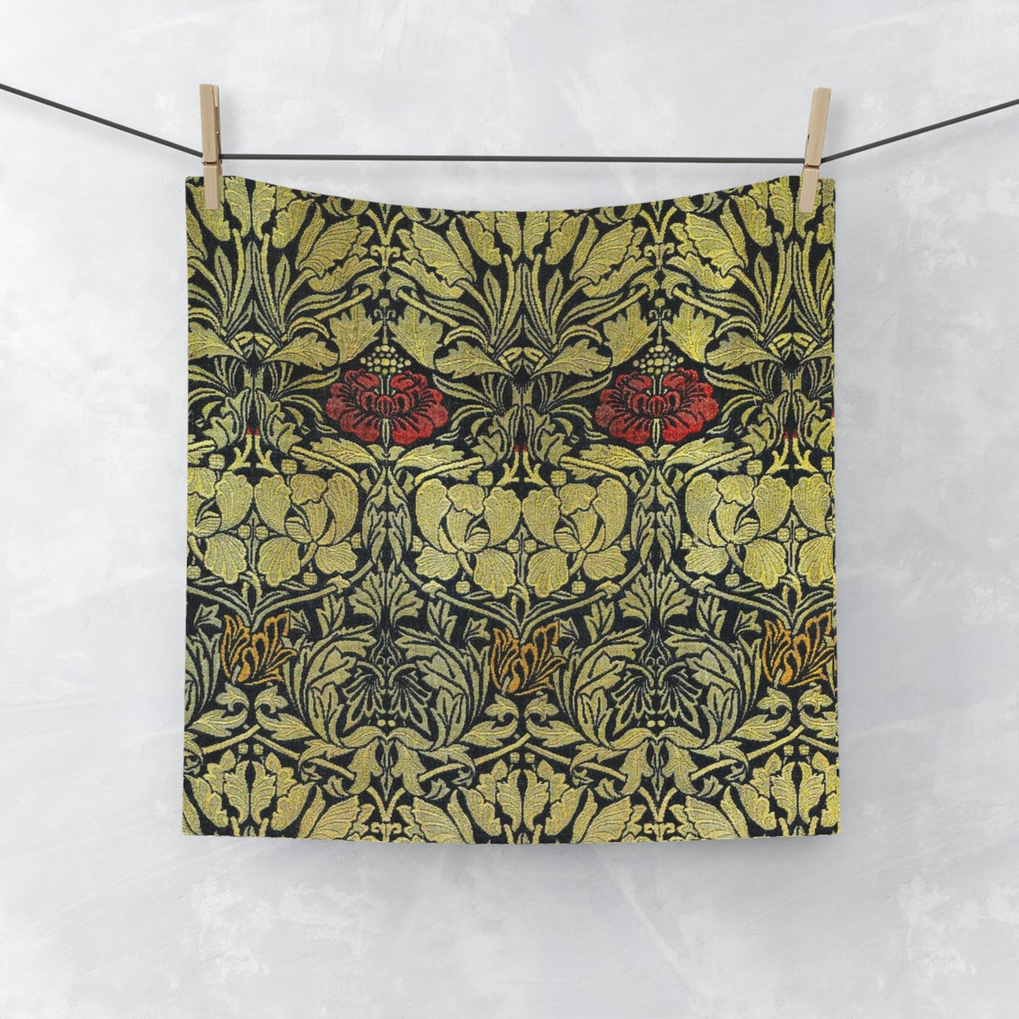 A washcloth with a floral pattern inspired by William Morris, featuring tulips and roses in red and green colors on a beige background.