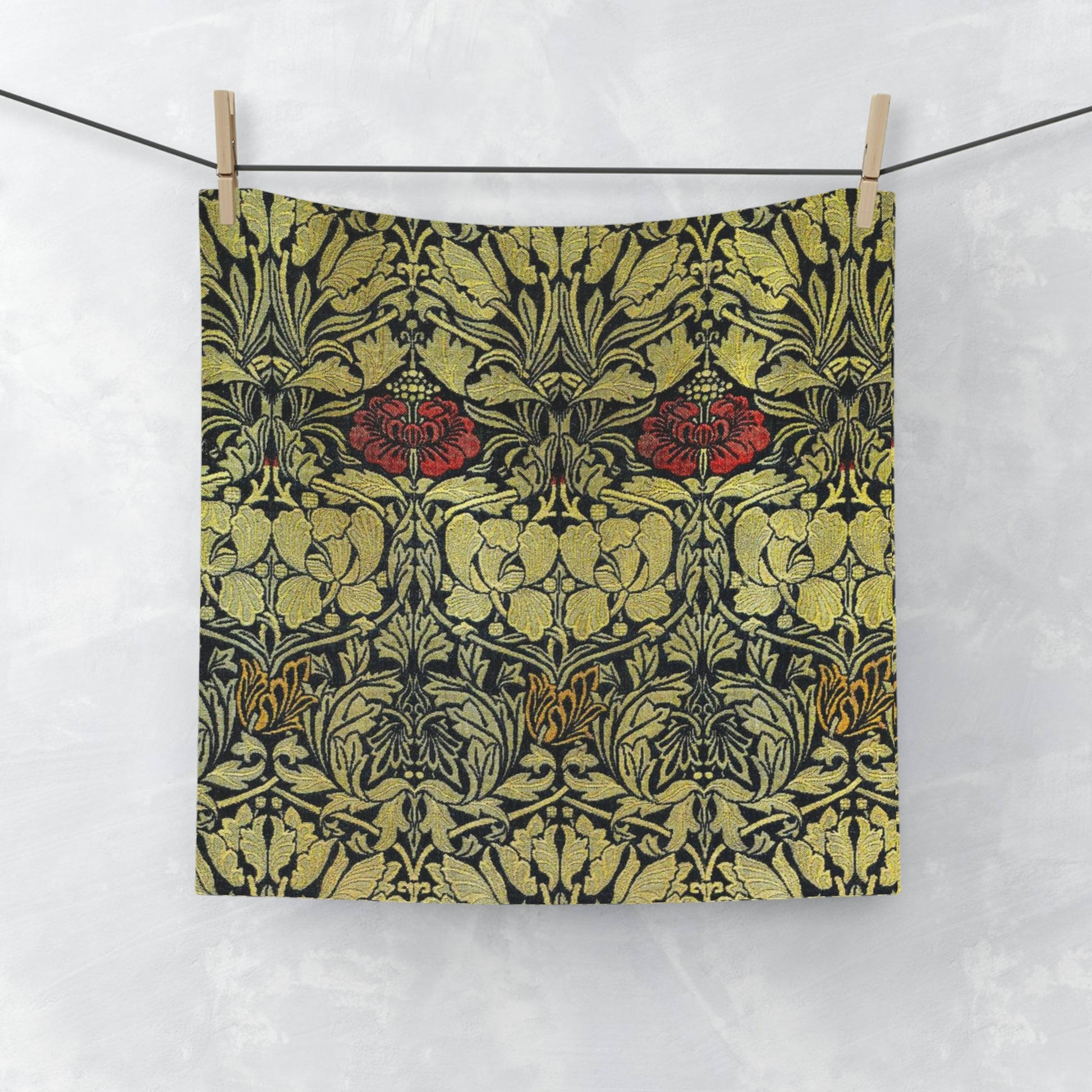 A washcloth with a floral pattern inspired by William Morris, featuring tulips and roses in red and green colors on a beige background.