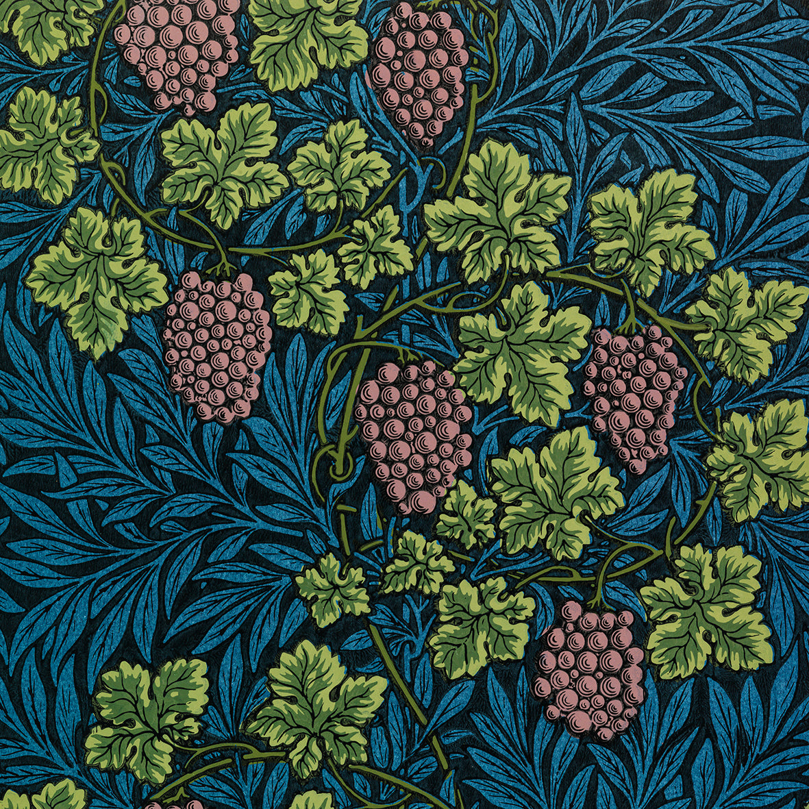 A white washcloth with a floral pattern inspired by William Morris, featuring green leaves and pink grapes.