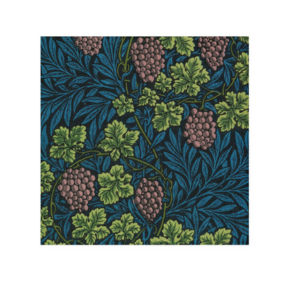 A white washcloth with a floral pattern inspired by William Morris, featuring green leaves and pink grapes.