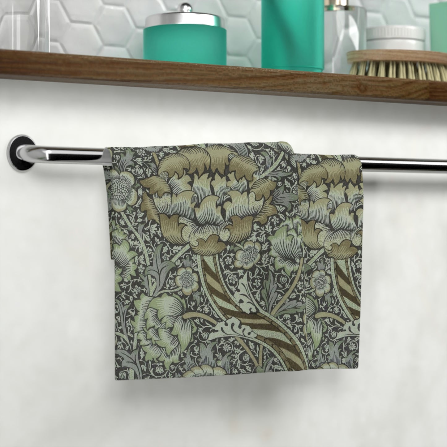A gray and multicoloured floral patterned washcloth inspired by William Morris' Wandle Collection.