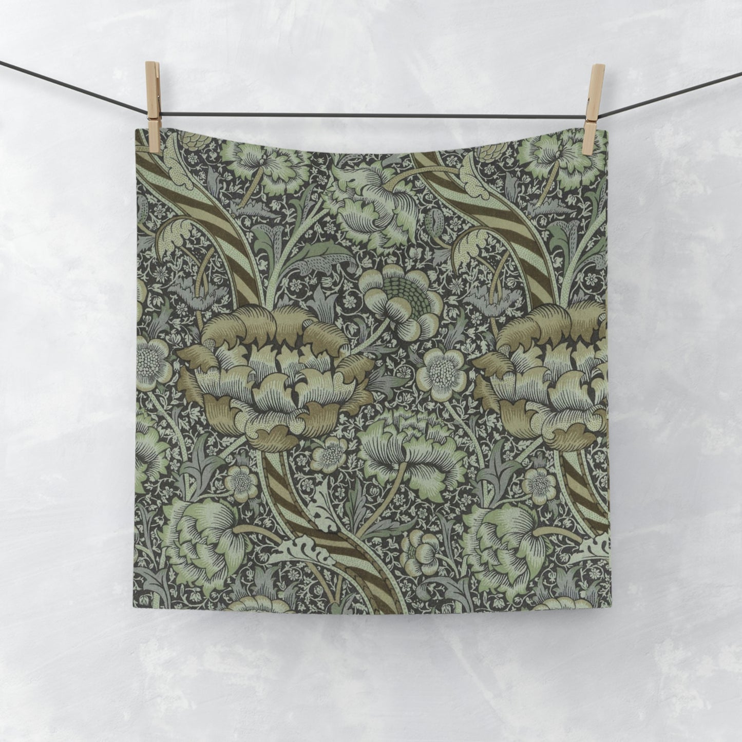 A gray and multicolored floral patterned washcloth inspired by William Morris' Wandle Collection.