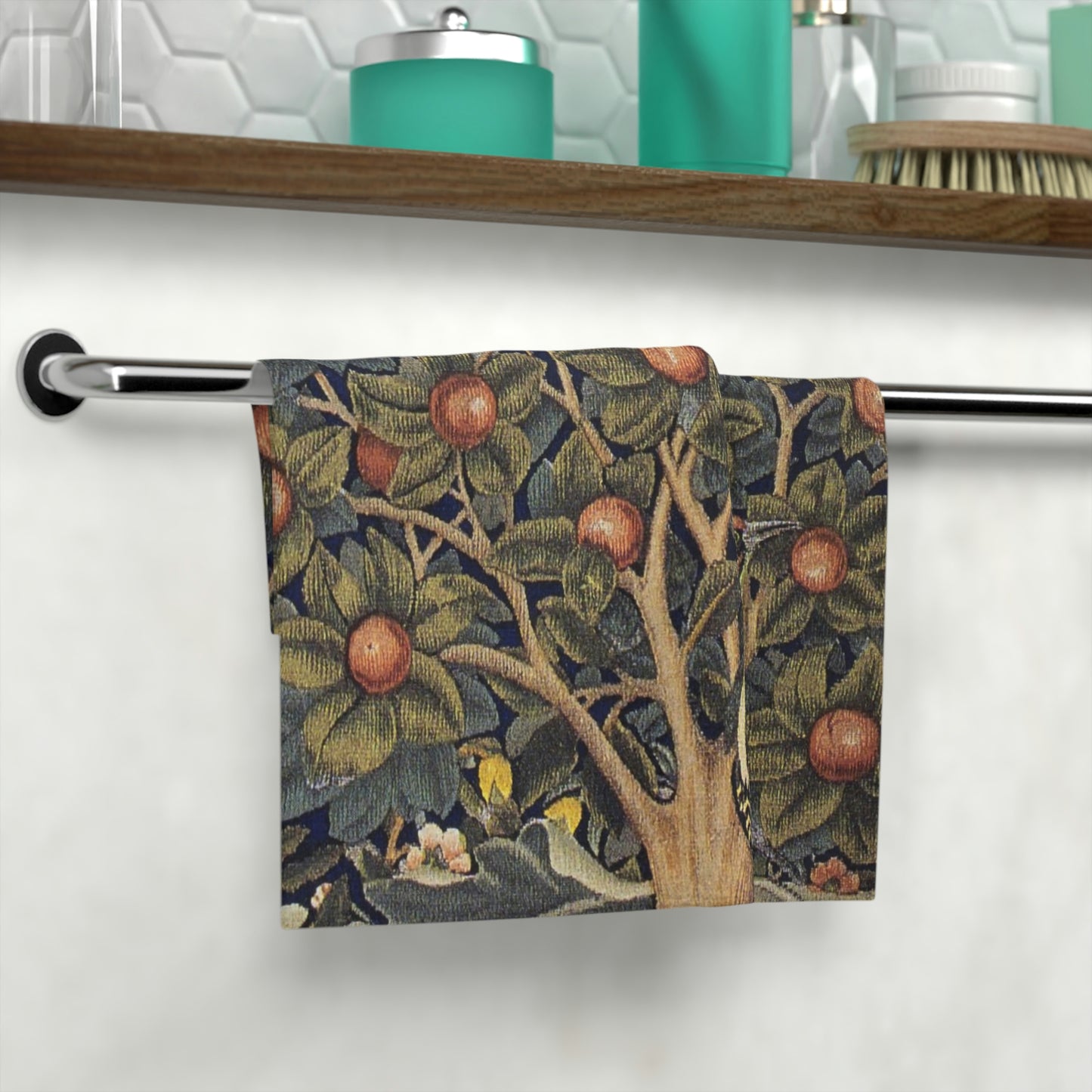 A washcloth with a floral pattern inspired by William Morris, featuring birds and woodpeckers amidst green leaves and red fruits.