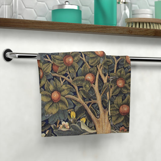 A washcloth with a floral pattern inspired by William Morris, featuring birds and woodpeckers amidst green leaves and red fruits.
