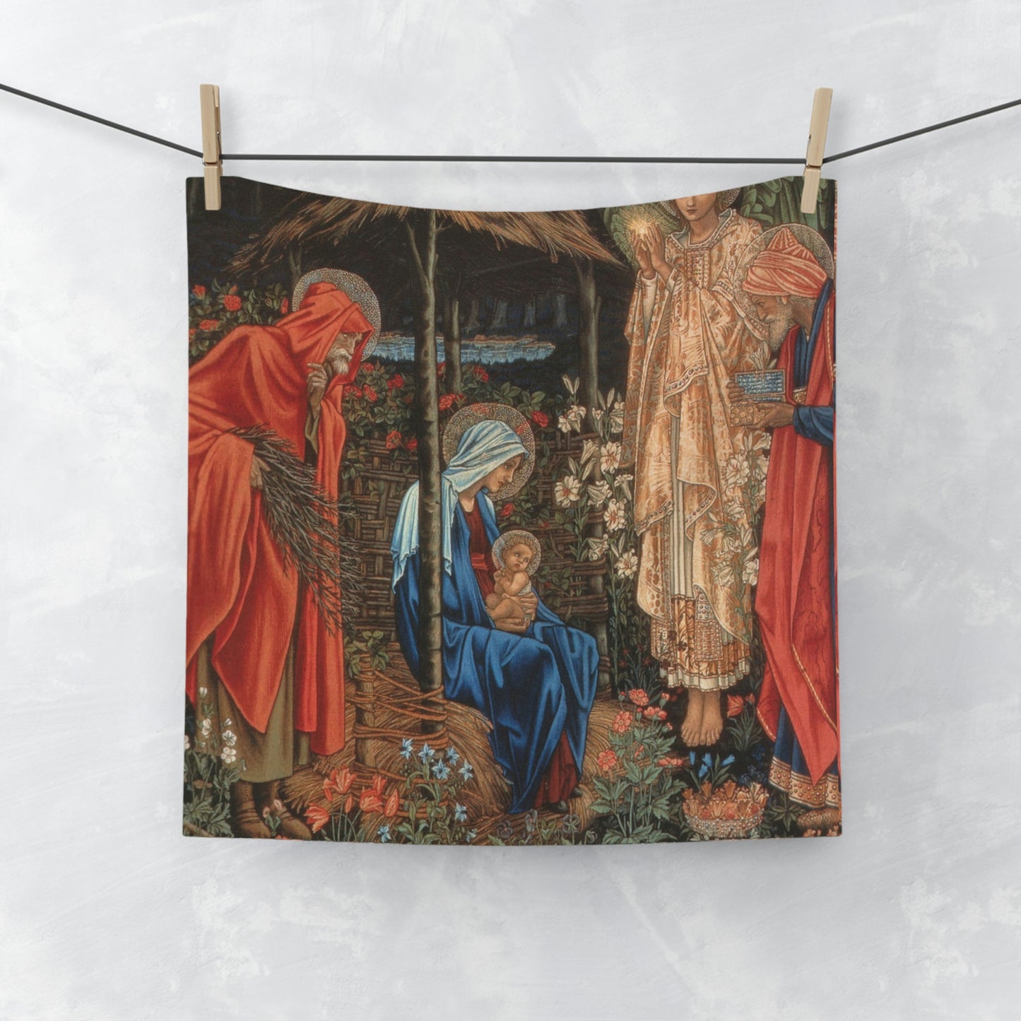 A washcloth featuring an artistic representation of a mother and child with floral elements, inspired by William Morris.