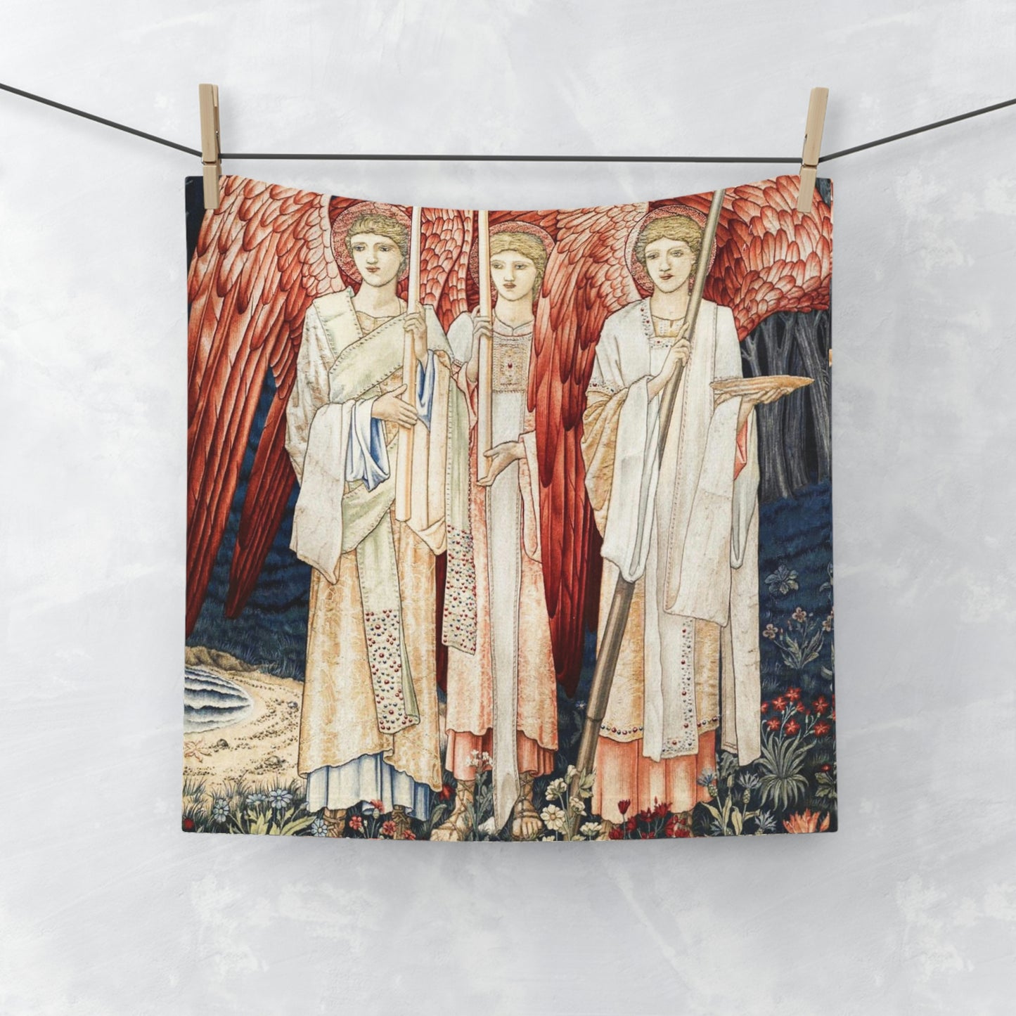 A washcloth featuring an artistic print with red angels inspired by William Morris from the Holy Grail Collection.