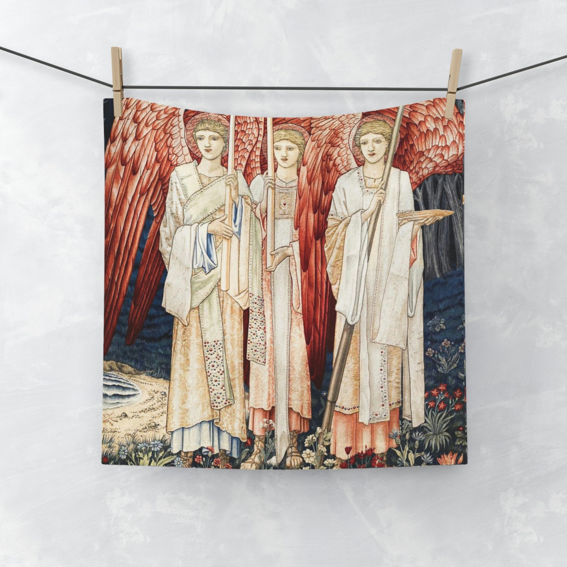 A washcloth featuring an artistic print with red angels inspired by William Morris from the Holy Grail Collection.