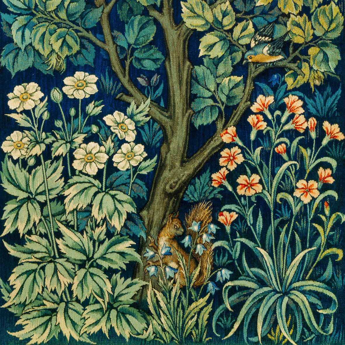 A white washcloth with a floral pattern inspired by William Morris, featuring an illustration of squirrels and leaves.
